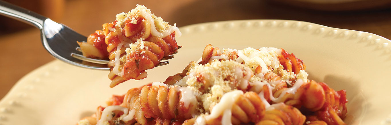 Serving of prepared Easy 2-Step Cheesy Pasta Twists recipe made with rotini and Prego® pasta sauce