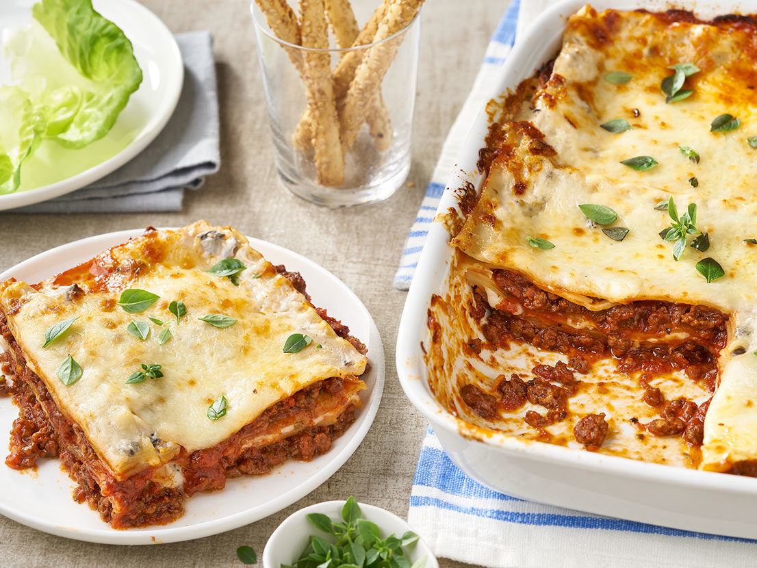An image of prepared Easy Classic Beef Lasagna showing layers of lasagna noodles, ground beef, Prego® Fresh Mushroom Italian Sauce, Campbell's® Condensed Cream of Mushroom Soup and mozzarella cheese.