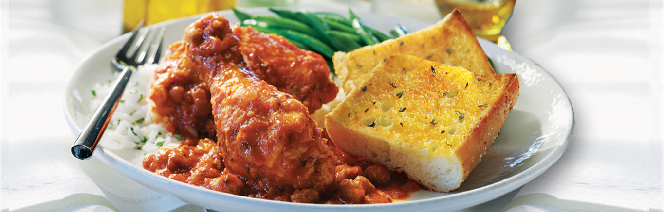 Serving of Italian Chicken with Garlic Bread made with Prego® sauce