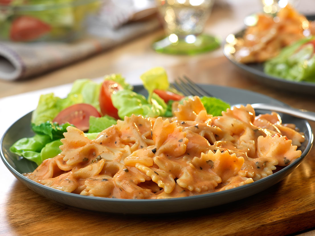 Serving of Pomodoro Alfredo Sauce with Bow Tie Pasta made with Prego® sauce
