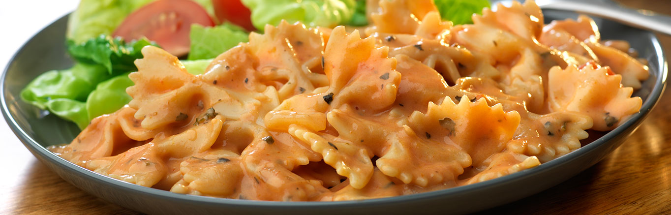Serving of Pomodoro Alfredo Sauce with Bow Tie Pasta made with Prego® sauce