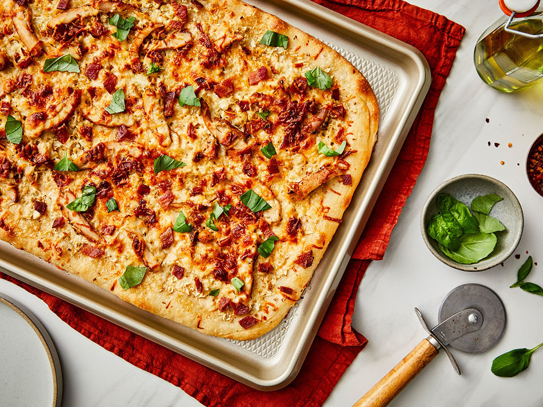 Image of prepared Sheet Pan Bacon Chicken Alfredo Pizza with Cauliflower